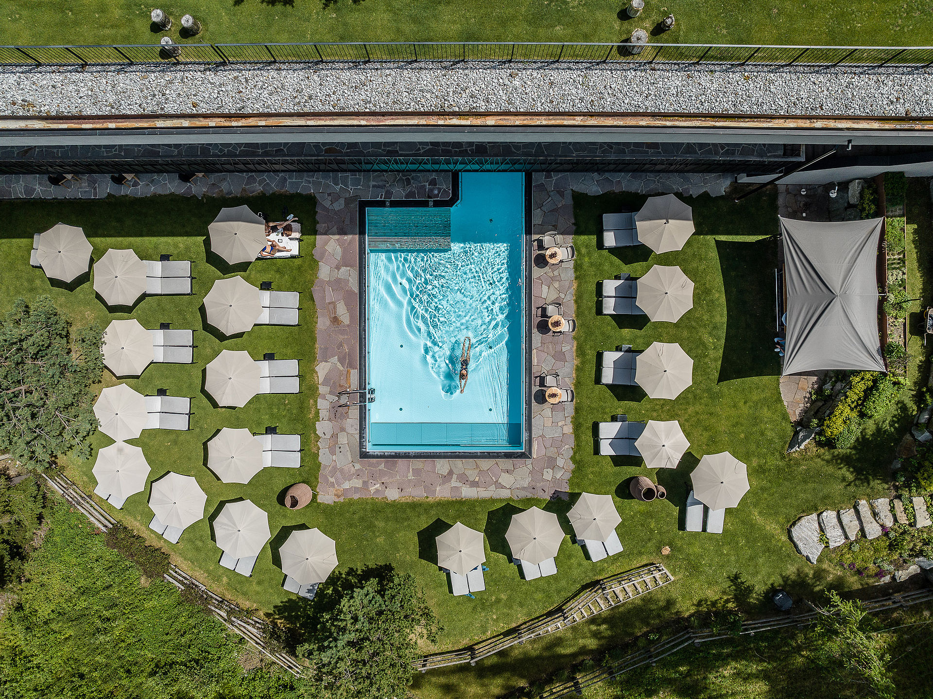 Swimming pool with garden from above